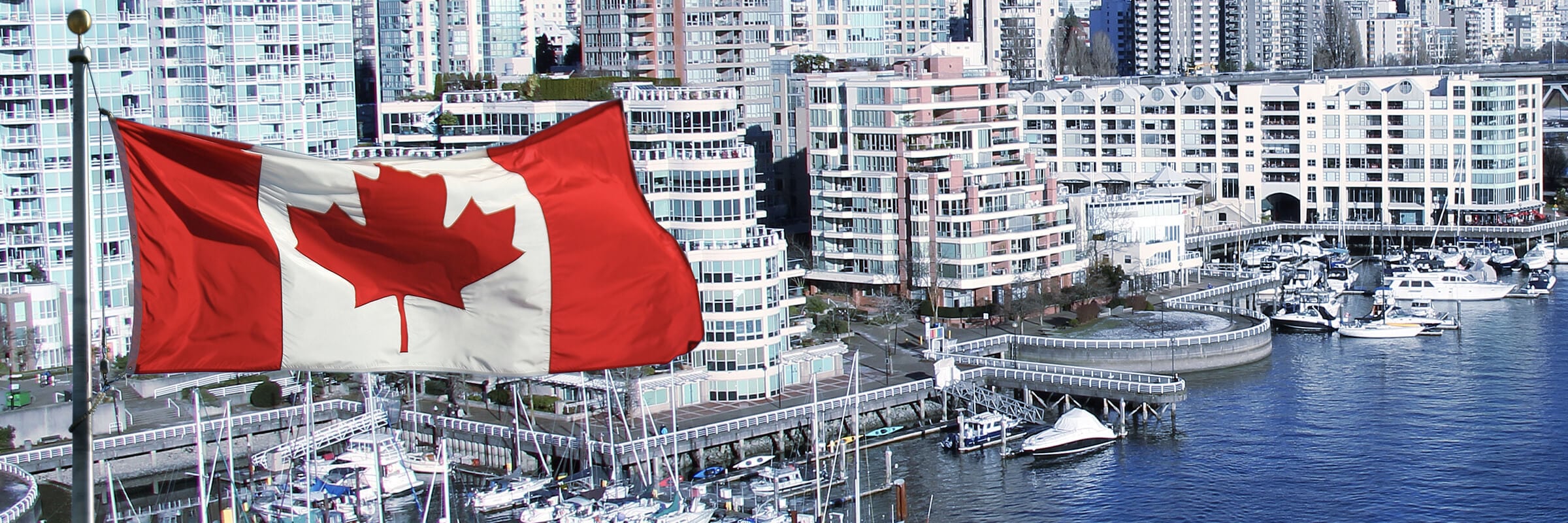 Canadian flag over city