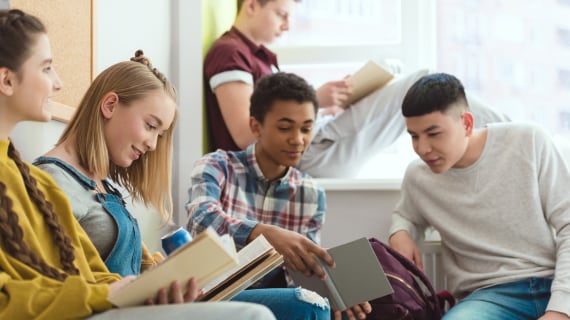 A group of students reading in the library