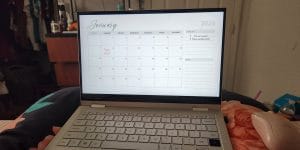 A college student’s laptop open to a calendar screen for January 2024.