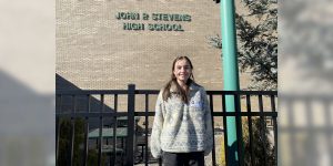 Blog author Maddy standing outside in front of the high school where she was a student teacher.