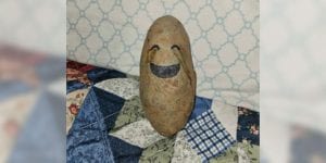 A potato with a drawn-on eyes and mouth to make it look like it’s crying.