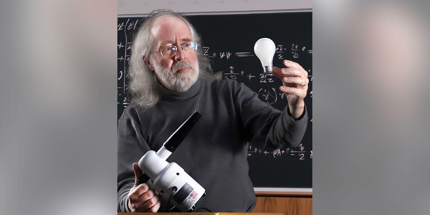 Brian Jones teaching with a lightbulb in hand