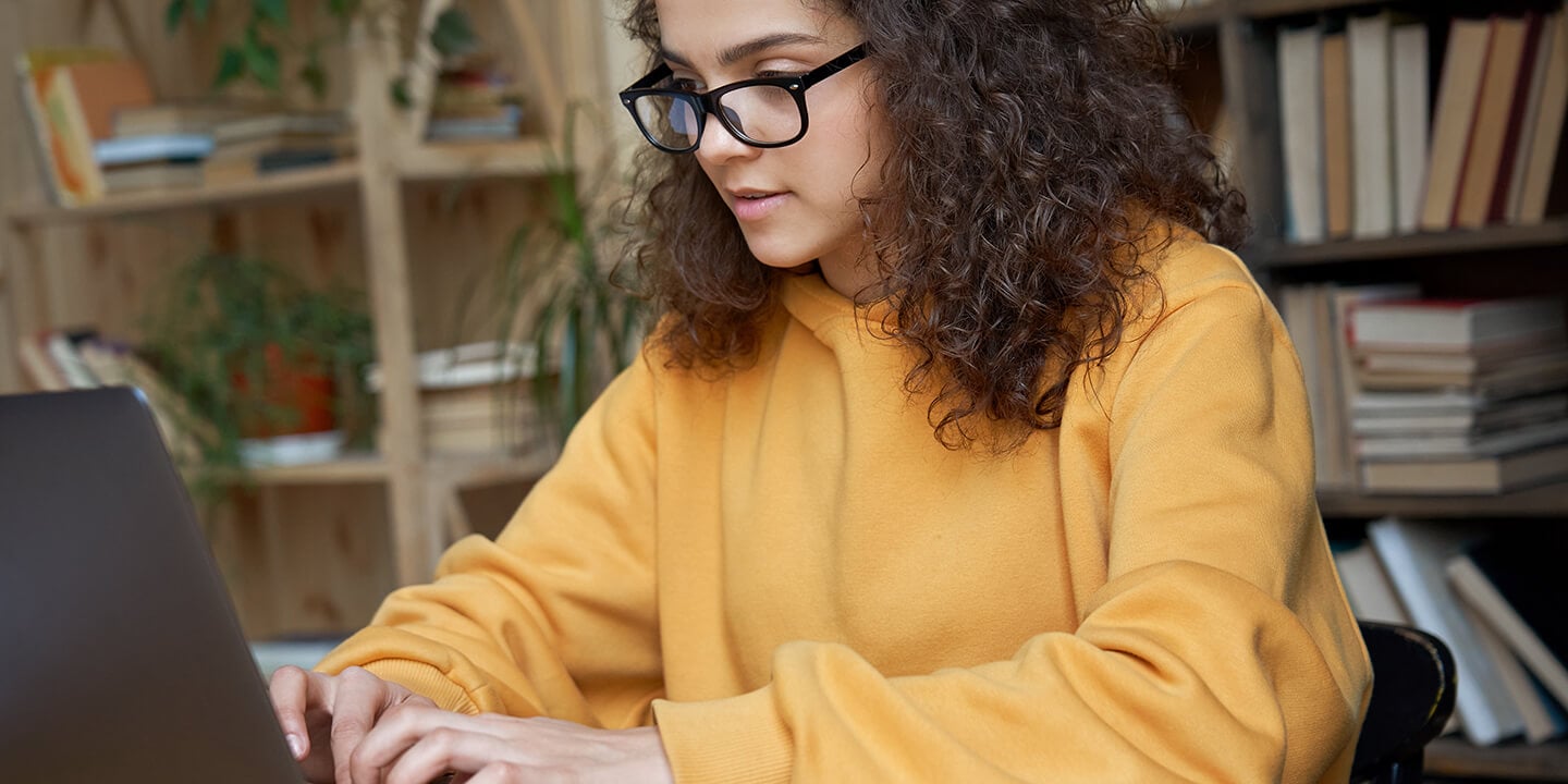 Student working at a laptop computer