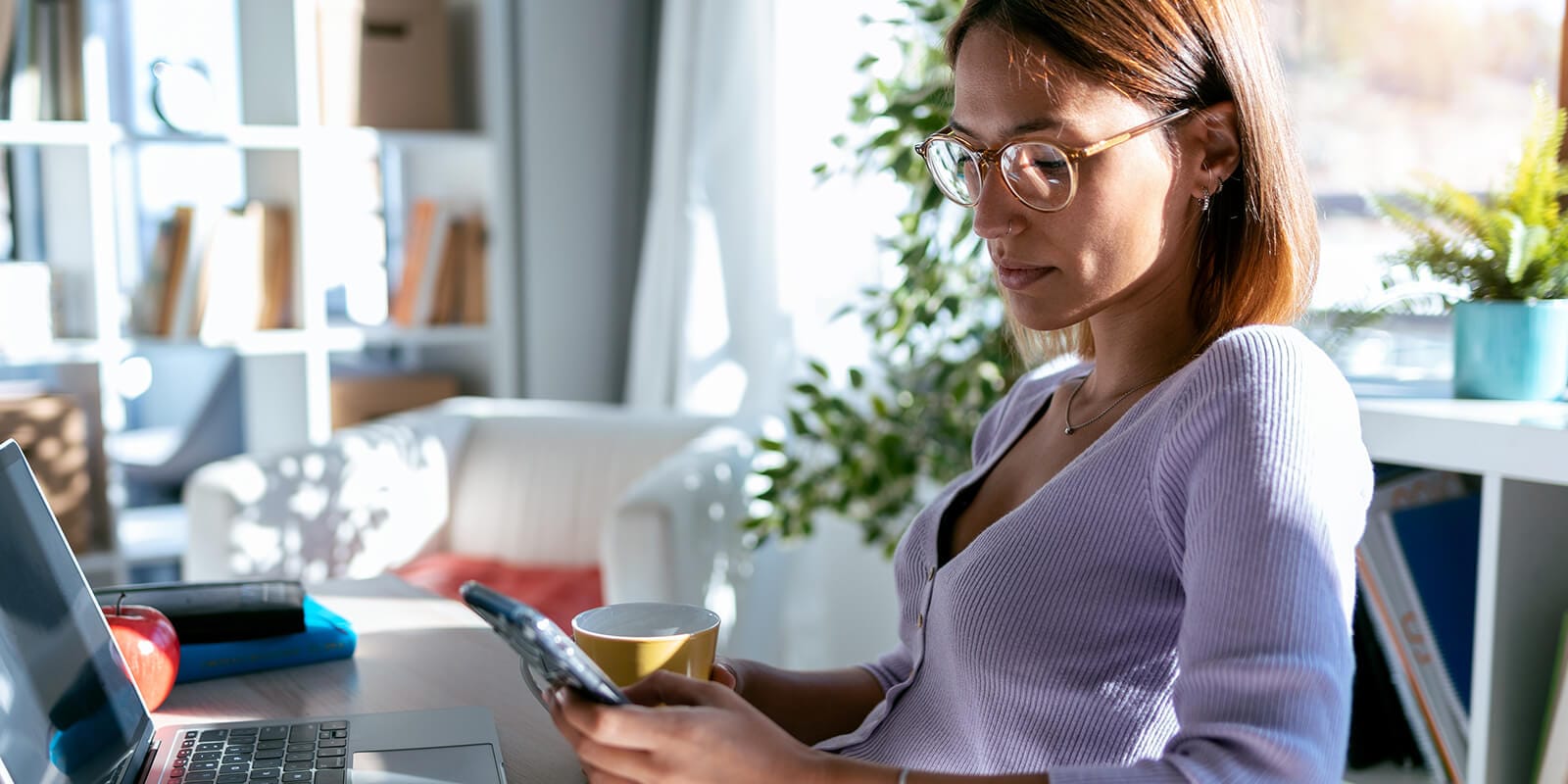 Woman reviewing content on her mobile phone.