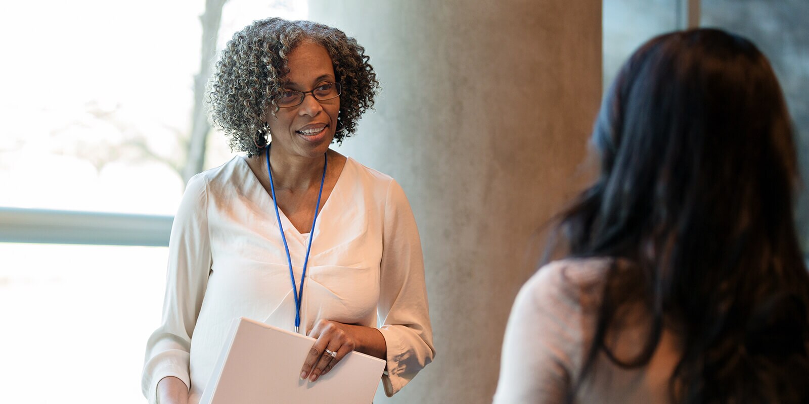 Image of teacher talking with a student