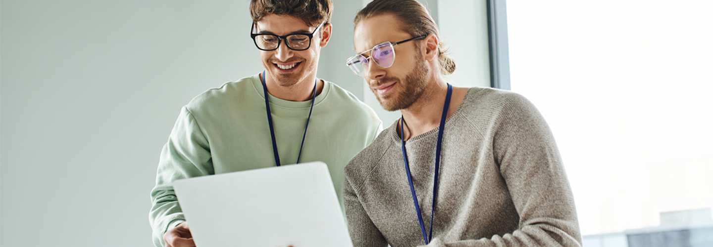 Two business men looking at a laptop