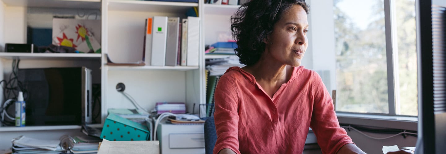 A woman at a computer working