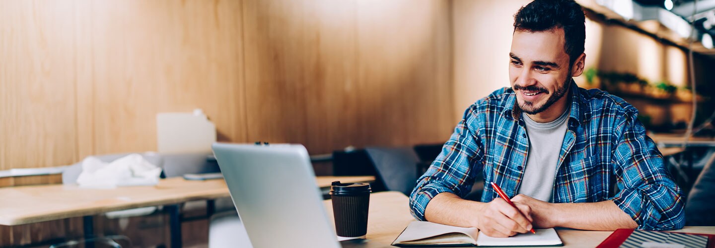 Man studying and smiling