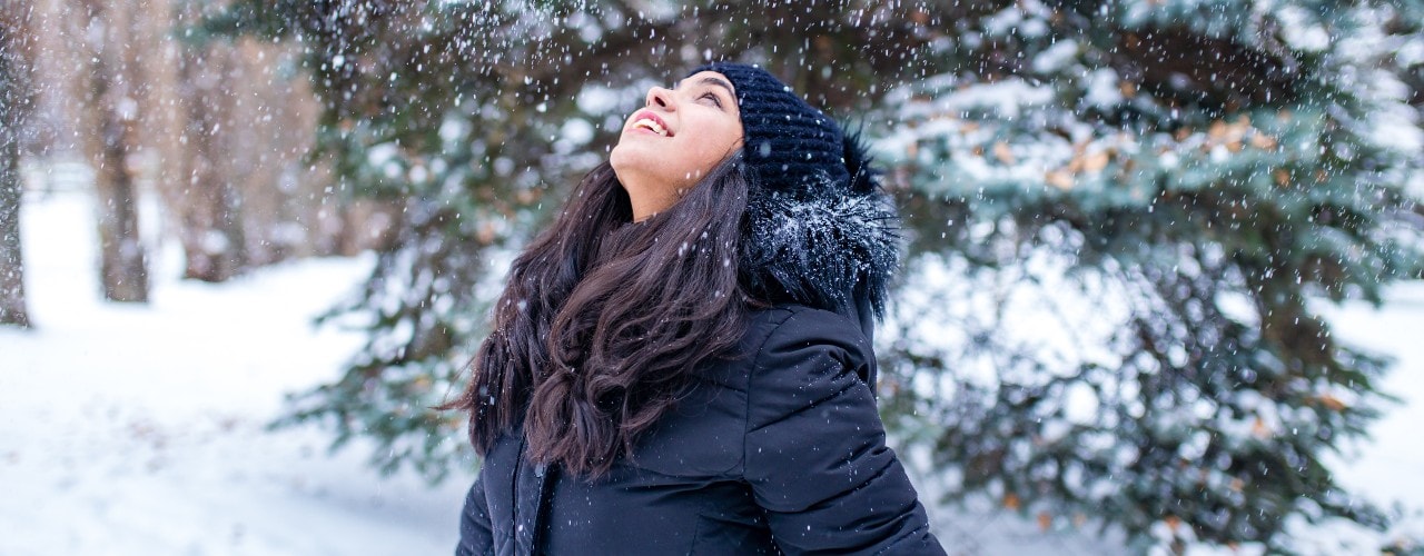 smiling woman in the snow